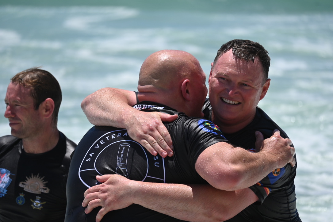 Veterans embracing at camp